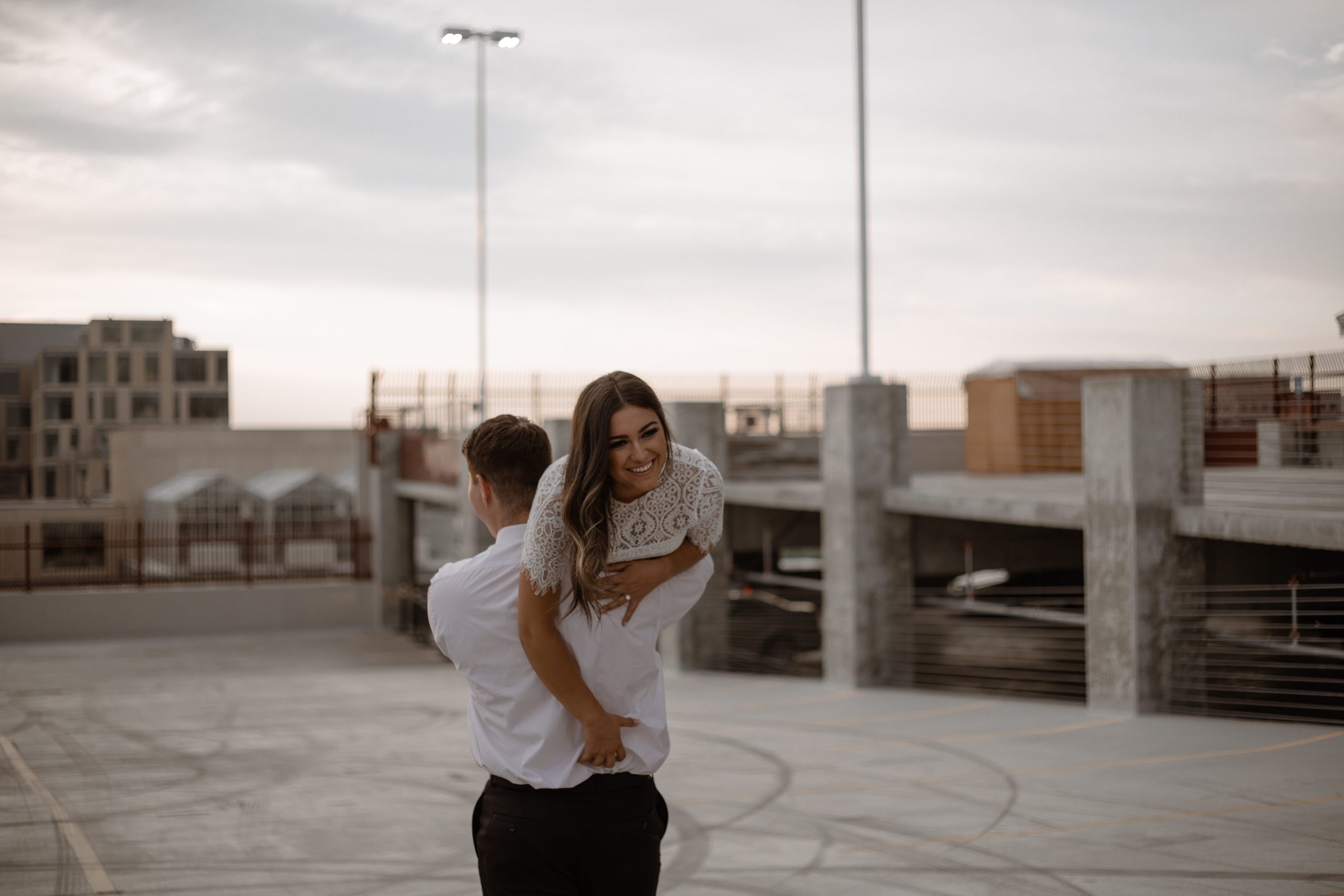 Groom carrying Bride over his shoulder